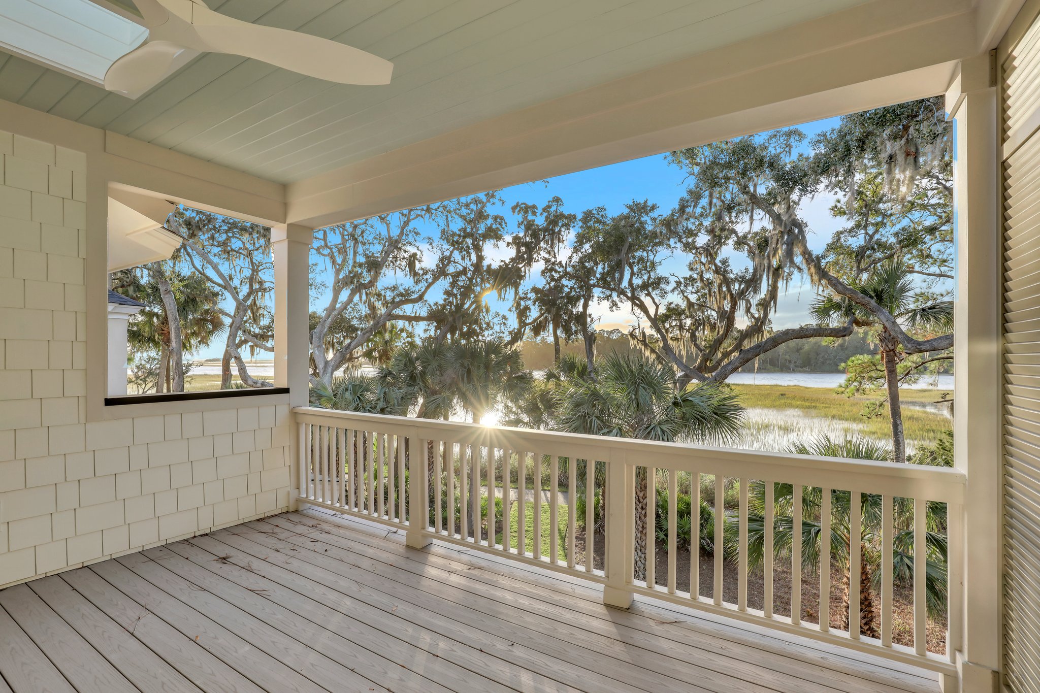 River view from second story covered porch in new coastal-inspired, low country home