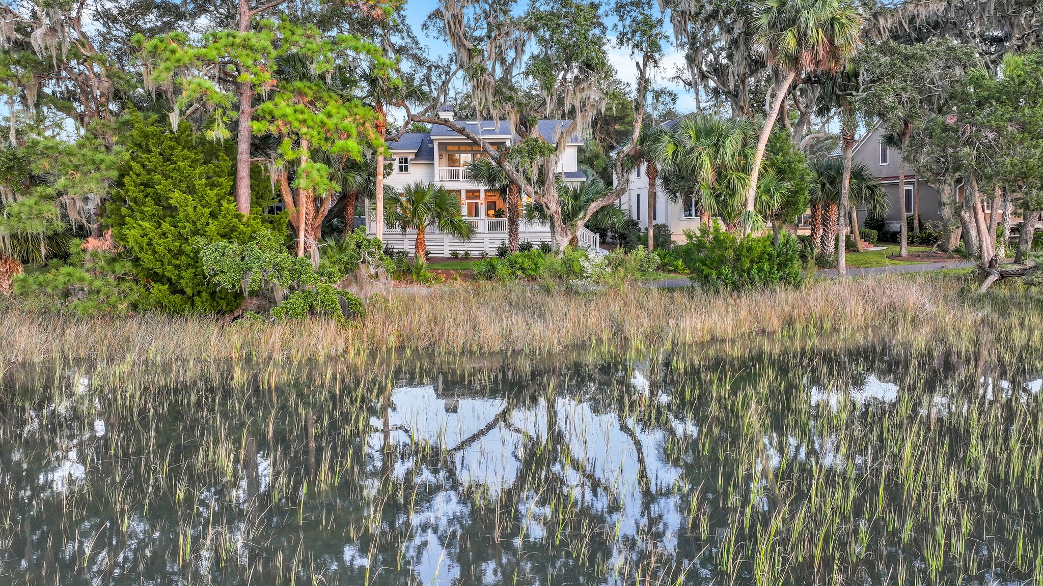 View of the back of new construction home designed by Reno Architecture with picturesque views of the river and marsh.