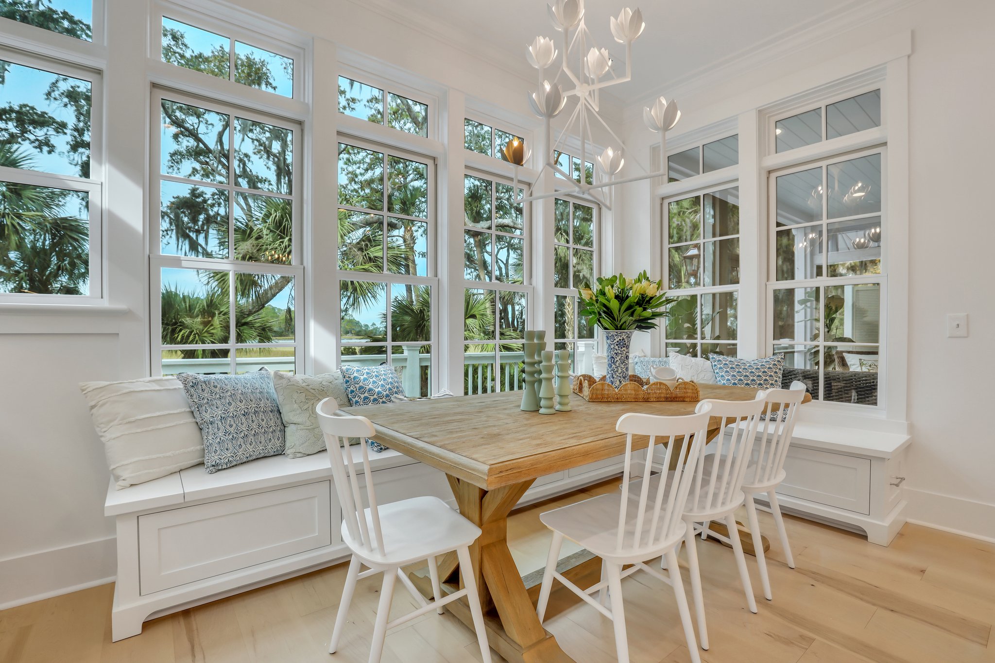 Coastal style, eat-in kitchen with banquet seating and marsh views designed by Reno Architecture of Richmond Hill, GA